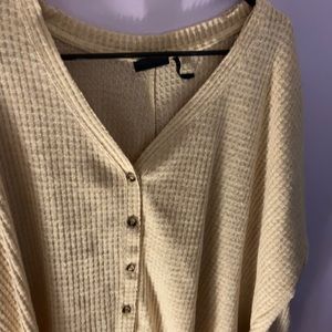 Medium sized tan sweater from Urban Outfitters.